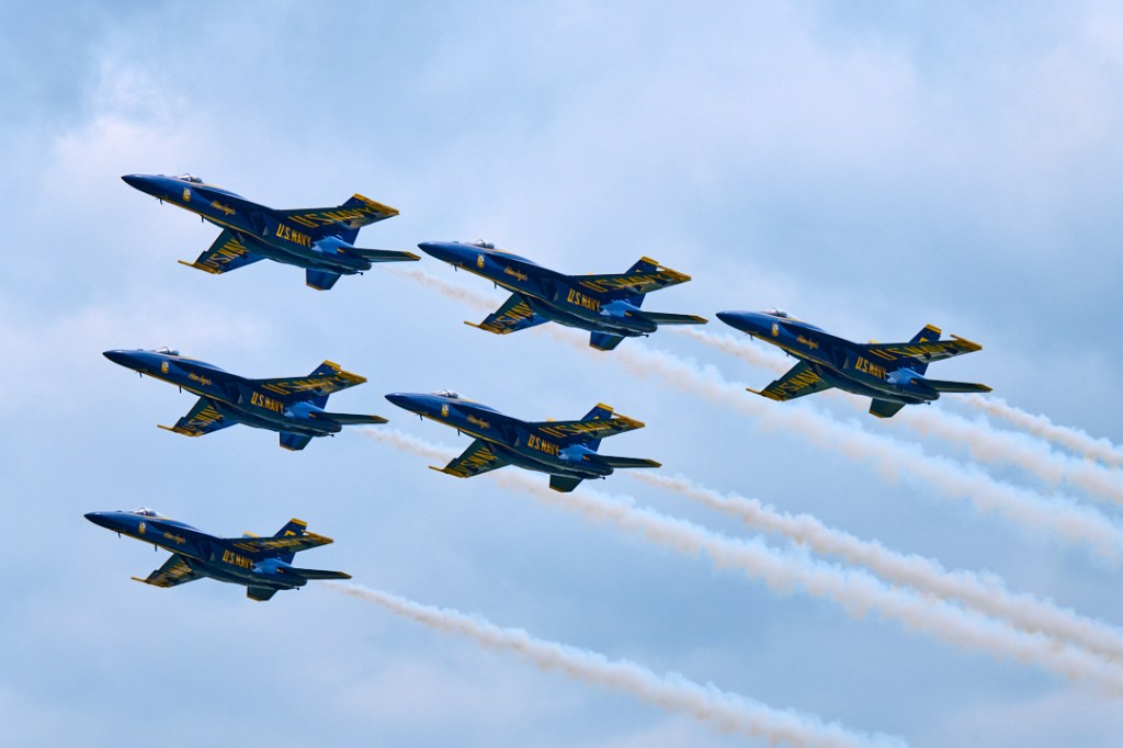 Navy Blue Angels in formation as they do a flyby in Oshkosh during EAA Air show